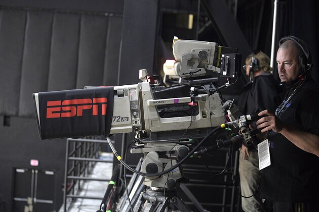 ESPN cameramen work during a WNBA basketball game between the Washington Mystics and the Las Vegas Aces, Saturday, Aug. 15, 2020, in Bradenton, Fla. (AP Photo/Phelan M. Ebenhack)