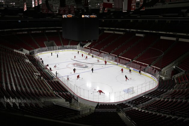 Carolina Hurricanes players take the ice during an NHL hockey training session in Raleigh, N.C., Wednesday, July 15, 2020. (AP Photo/Gerry Broome)