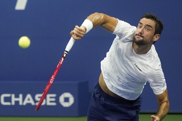 Marin Cilic, of Croatia, serves to Dominic Thiem, of Austria, during the third round of the US Open tennis championships, Saturday, Sept. 5, 2020, in New York. (AP Photo/Frank Franklin II)