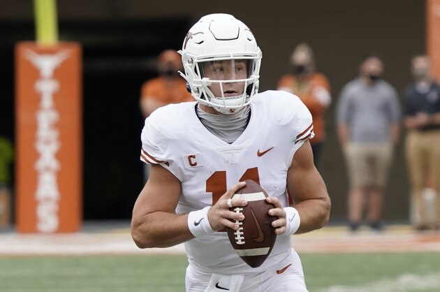 Texas' Sam Ehlinger (11) runs against Baylor during the first half of an NCAA college football game in Austin, Texas, Saturday, Oct. 24, 2020. (AP Photo/Chuck Burton)