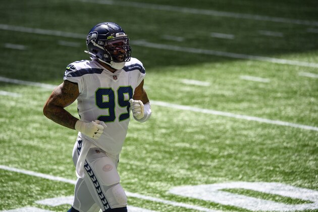 Seattle Seahawks defensive end Damontre Moore (99) returns to the sideline during the first half of an NFL football game against the Atlanta Falcons, Sunday, Sept. 13, 2020, in Atlanta. The Seattle Seahawks won 38-25. (AP Photo/Danny Karnik)