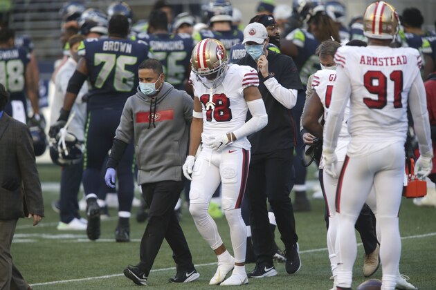 San Francisco 49ers wide receiver Dante Pettis (18) leaves the field with an injury during the second half of an NFL football game against the Seattle Seahawks, Sunday, Nov. 1, 2020, in Seattle. The Seahawks won 37-27. (AP Photo/Scott Eklund)