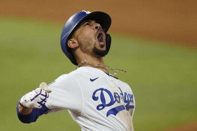 Los Angeles Dodgers' Mookie Betts celebrates after a home run against the Tampa Bay Rays during the eighth inning in Game 6 of the baseball World Series Tuesday, Oct. 27, 2020, in Arlington, Texas. (AP Photo/Eric Gay)