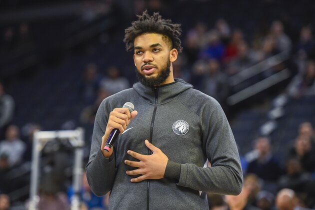 Minnesota Timberwolves forward Karl-Anthony TownsÂ pays tribute to Kobe Bryant, who died Sunday in a helicopter accident, before the start of their NBA basketball game against the Sacramento Kings Monday, Jan. 27, 2020, in Minneapolis. (AP Photo/Craig Lassig)
