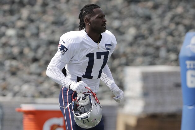 New England Patriots wide receiver Antonio Brown carries his helmet during an NFL football practice, Wednesday, Sept. 18, 2019, in Foxborough, Mass. (AP Photo/Steven Senne)
