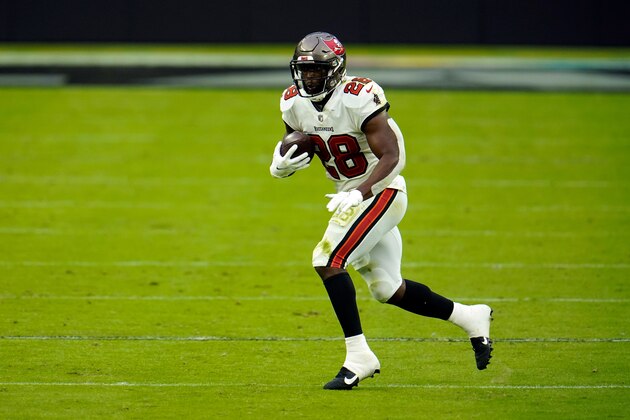 Tampa Bay Buccaneers running back Leonard Fournette (28) rushes the ball against Las Vegas Raiders during the first half of an NFL football game, Sunday, Oct. 25, 2020, in Las Vegas. (AP Photo/Jeff Bottari)