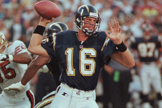 San Diego Chargers quarterback Ryan Leaf, the number two pick in this year's NFL draft, aims a pass downfield in his first game as professional Saturday Aug. 8, 1998 in San Diego. Leaf and the Chargers squared off against the San Francisco 49ers. The pass was complete for a nine yard gain to Mikhael Ricks. (AP Photo/Lenny Ignelzi)
