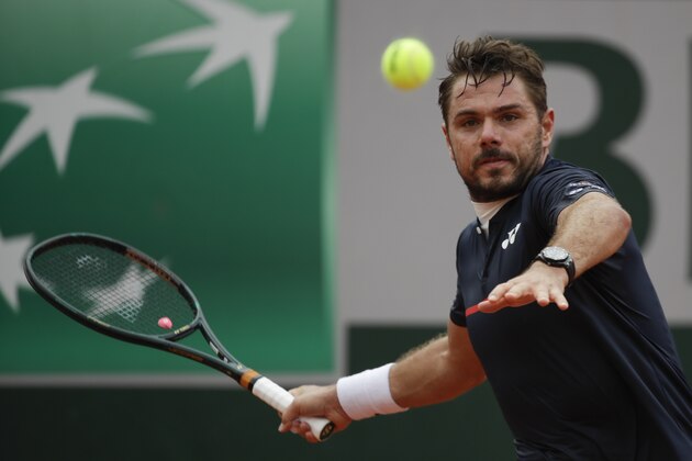 Switzerland's Stan Wawrinka plays a shot against Germany's Dominik Koepfer in the second round match of the French Open tennis tournament at the Roland Garros stadium in Paris, France, Wednesday, Sept. 30, 2020. (AP Photo/Alessandra Tarantino)