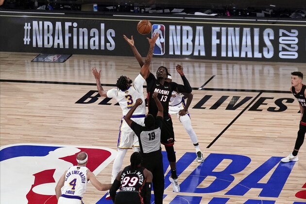 Los Angeles Lakers' Anthony Davis (3) and Miami Heat's Bam Adebayo (13) for the tipoff during the first half in Game 6 of basketball's NBA Finals Sunday, Oct. 11, 2020, in Lake Buena Vista, Fla. (AP Photo/John Raoux) Los Angeles Lakers' Anthony Davis (3) and Miami Heat's Bam Adebayo (13) for the tipoff during the first half in Game 6 of basketball's NBA Finals Sunday, Oct. 11, 2020, in Lake Buena Vista, Fla. (AP Photo/John Raoux)