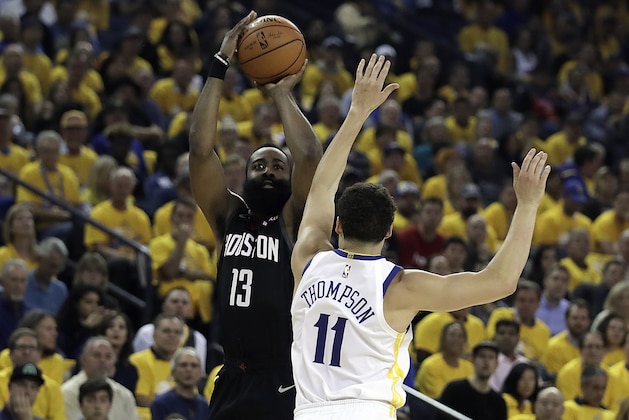 Houston Rockets' James Harden, left, shoots against Golden State Warriors' Klay Thompson (11) during the first half of Game 5 of a second-round NBA basketball playoff series Wednesday, May 8, 2019, in Oakland, Calif. (AP Photo/Ben Margot)