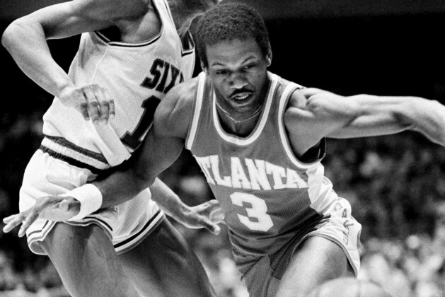 Atlanta Hawks Eddie Johnson (3) drives under guard of Philadelphia 76ers Maurice Cheeks on the way to a first period field goal try in the first game of NBA playoff series at Philadelphia, April 6, 1980. (AP Photo/Gene Puskar)