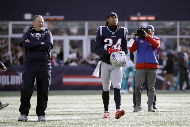 New England Patriots head coach Bill Belichick, left, and New England Patriots cornerback Stephon Gilmore stand on the field as the team warms up before an NFL football game against the Miami Dolphins, Sunday, Dec. 29, 2019, in Foxborough, Mass. (AP Photo/Elise Amendola)