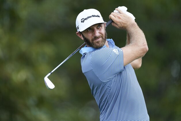 Dustin Johnson hits on the third tee during the first round of the Tour Championship golf tournament at East Lake Golf Club in Atlanta, Friday, Sept. 4, 2020. (AP Photo/John Bazemore)