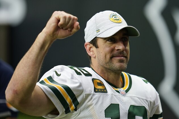Green Bay Packers quarterback Aaron Rodgers (12) fist pumps the crowd as he walks off the field after an NFL football game against the Houston Texans, Sunday, Oct. 11, 2020, in Houston. (AP Photo/Matt Patterson)