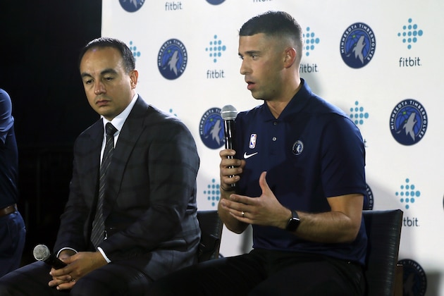 Minnesota Timberwolves head coach Ryan Saunders, right, addresses the media as Timberwolves President Gersson Rosas listens during the NBA basketball team's media day Monday, Sept. 30, 2019, in Minneapolis. (AP Photo/Jim Mone)
