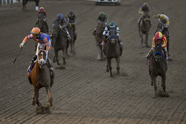 Irad Ortiz Jr., left, aboard Vino Rosso celebrates after winning the Breeders' Cup Classic horse race at Santa Anita Park, Saturday, Nov. 2, 2019, in Arcadia, Calif. (AP Photo/Mark J. Terrill)