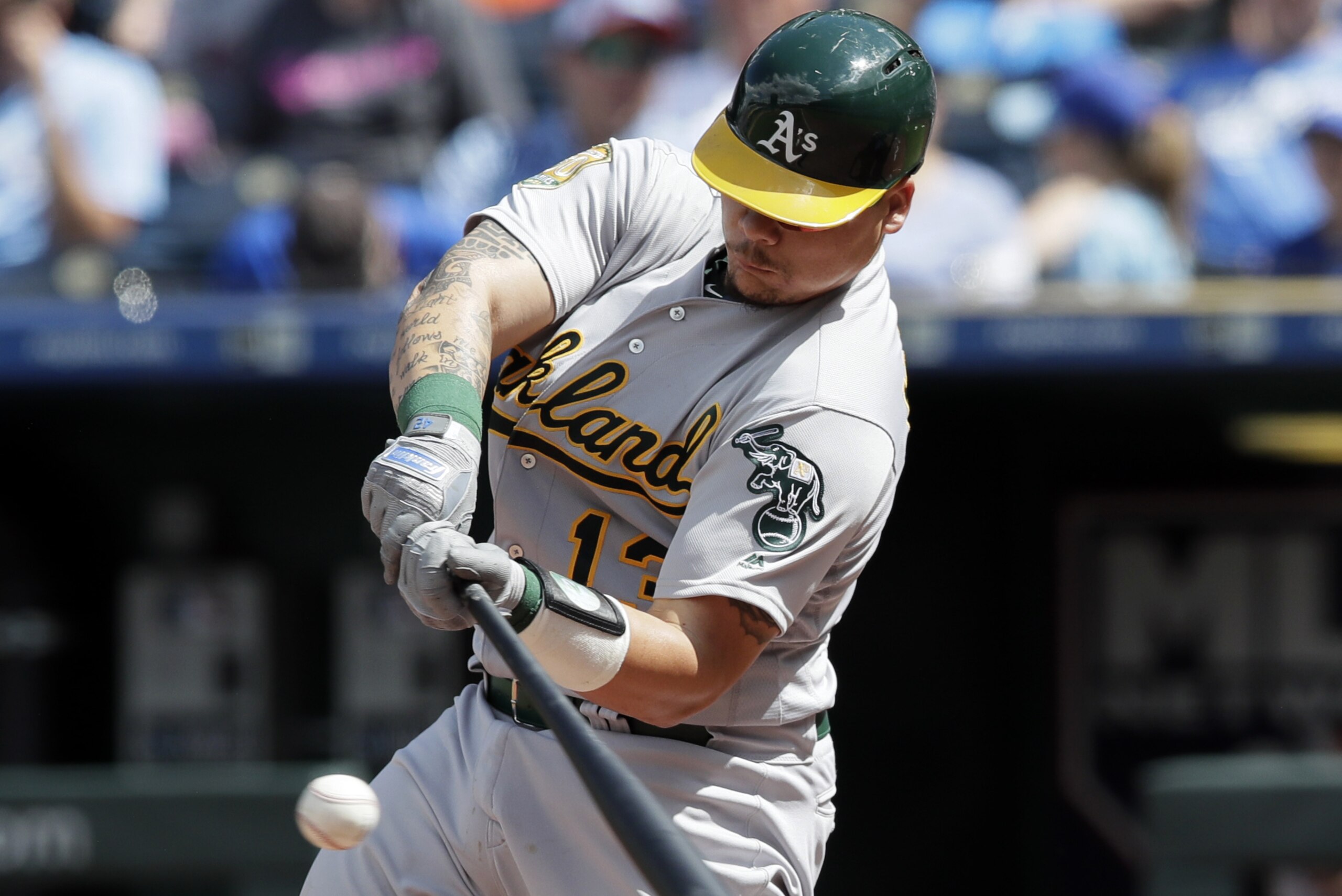 Oakland Athletics' Bruce Maxwell hits a solo home run off Kansas City Royals starting pitcher Jason Hammel during the seventh inning of a baseball game at Kauffman Stadium in Kansas City, Mo., Saturday, June 2, 2018. (AP Photo/Orlin Wagner) Oakland Athletics' Bruce Maxwell hits a solo home run off Kansas City Royals starting pitcher Jason Hammel during the seventh inning of a baseball game at Kauffman Stadium in Kansas City, Mo., Saturday, June 2, 2018. (AP Photo/Orlin Wagner)