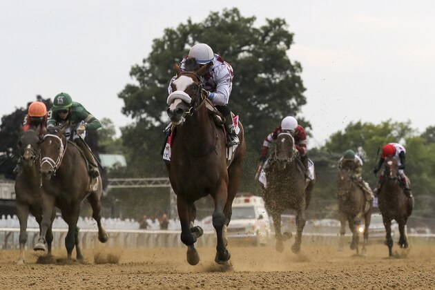 Tiz the Law, center, with jockey Manny Franco up, crosses the finish line to win the152nd running of the Belmont Stakes horse race, Saturday, June 20, 2020, in Elmont, N.Y. (AP Photo/Seth Wenig)