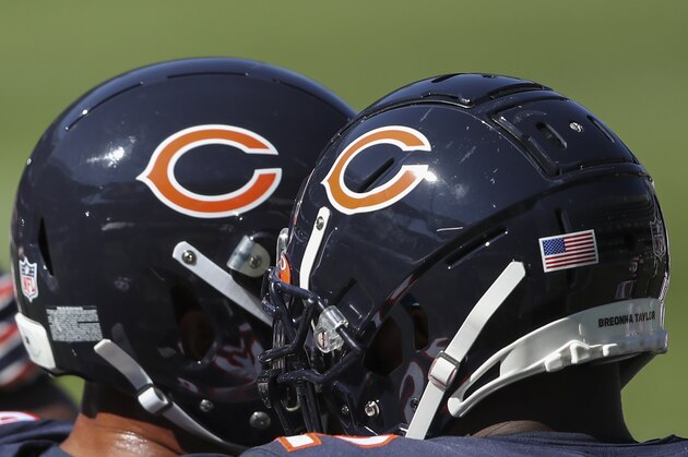 Chicago Bears players in their helmets during the second half of an NFL football game against the New York Giants, Sunday, Sept. 20, 2020, in Chicago. (AP Photo/Kamil Krzaczynski)