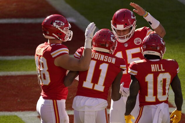 Kansas City Chiefs' Nick Keizer (48), Demarcus Robinson (11), Tyreek Hill (10) and Patrick Mahomes (15), celebrate a touchdown scored on a catch by Robinson in the second half of an NFL football game agains the New York Jets on Sunday, Nov. 1, 2020, in Kansas City, Mo. (AP Photo/Charlie Riedel)