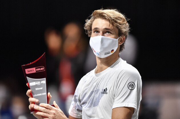 Germany's Alexander Zverev celebrates with the trophy after winning the ATP bett1HULKS Championship tennis final against Argentina's Diego Schwartzmann in Cologne, Germany, Sunday, Oct. 25, 2020. Zverev defeated Schwartzmann 6-2, 6-1. (AP Photo/Martin Meissner)