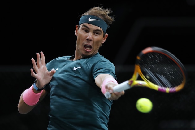 Spain's Rafael Nadal returns the ball to Australia's Jordan Thompson during the third round of the Paris Masters tennis tournament at the Bercy Arena in Paris, Thursday, Nov. 5, 2020. (AP Photo/Christophe Ena)