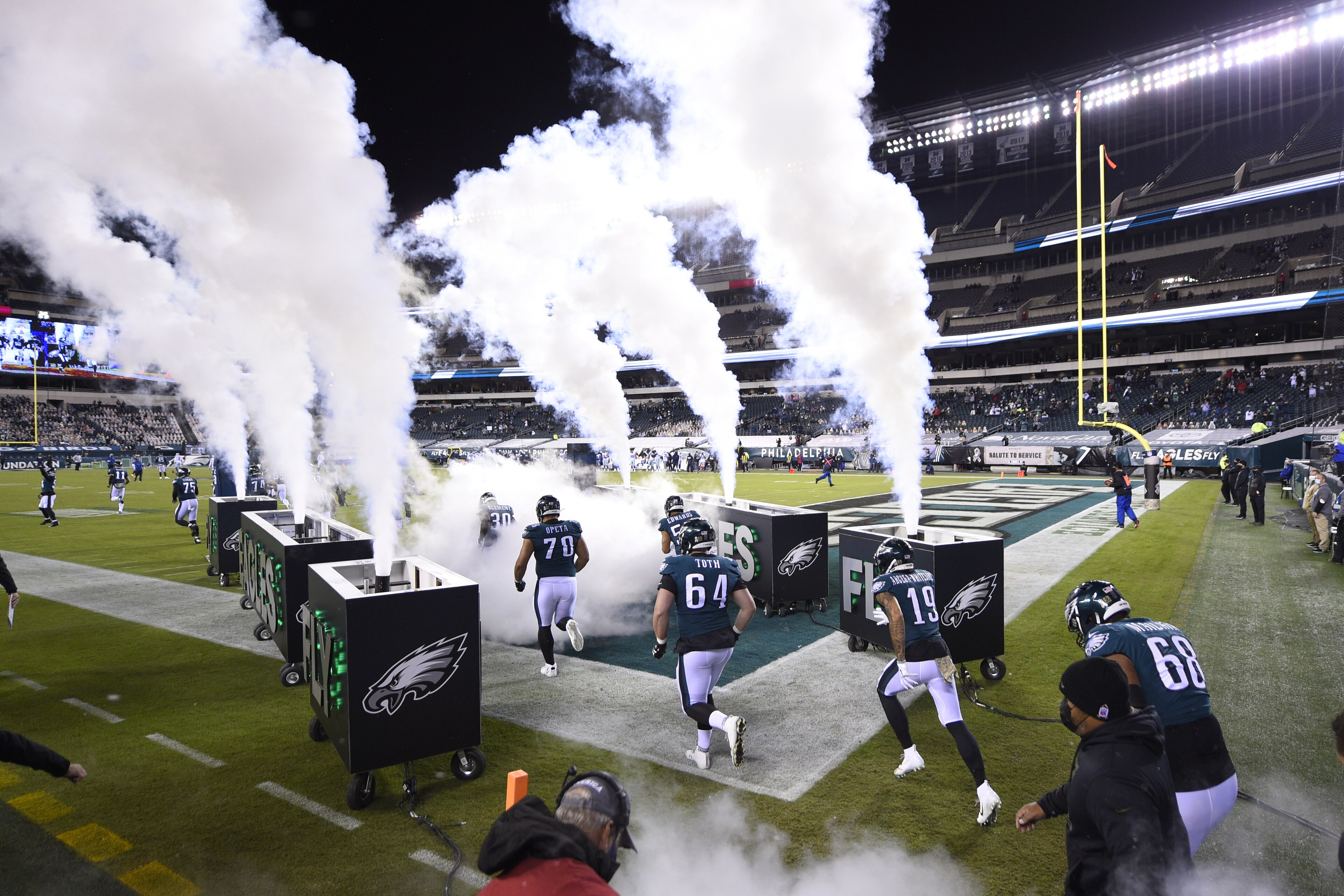Philadelphia Eagles players run onto the field before an NFL football game against the Dallas Cowboys, Sunday, Nov. 1, 2020, in Philadelphia. (AP Photo/Derik Hamilton)