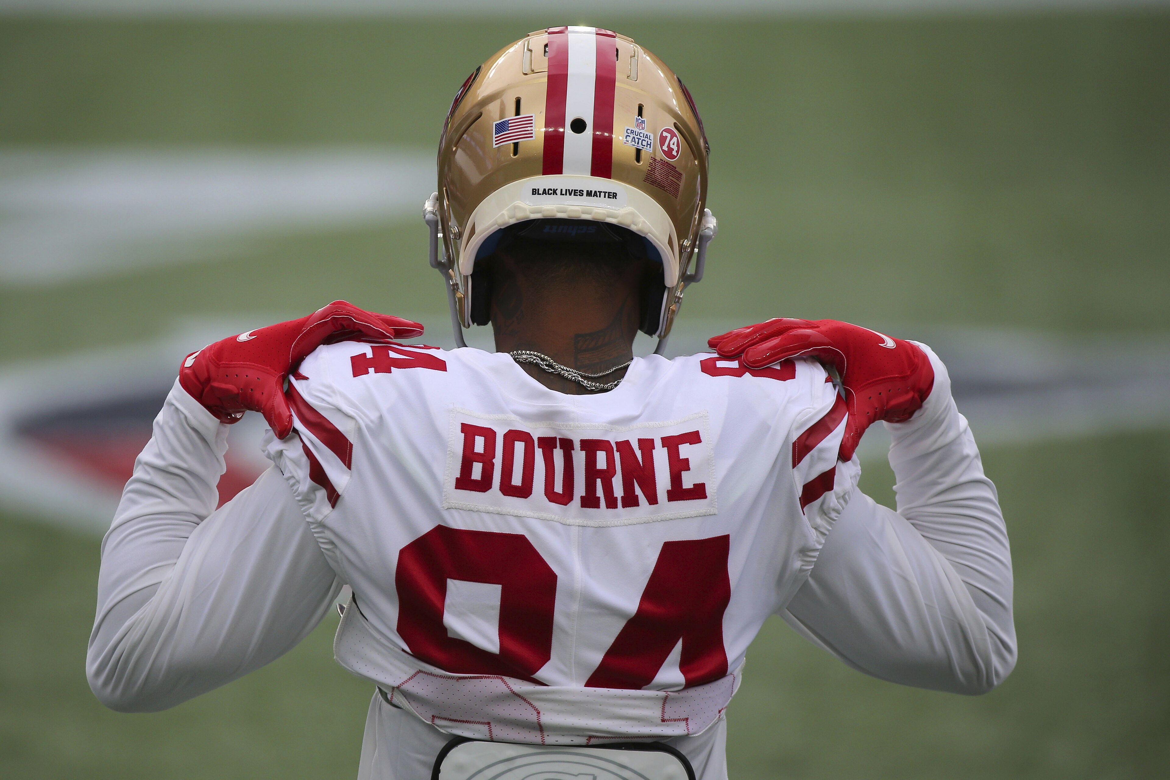 San Francisco 49ers wide receiver Kendrick Bourne (84) wears a social justice decal on the back of his helmet prior to an NFL football game against the New England Patriots, Sunday, Oct. 25, 2020, in Foxborough, Mass. (AP Photo/Stew Milne) San Francisco 49ers wide receiver Kendrick Bourne (84) wears a social justice decal on the back of his helmet prior to an NFL football game against the New England Patriots, Sunday, Oct. 25, 2020, in Foxborough, Mass. (AP Photo/Stew Milne)