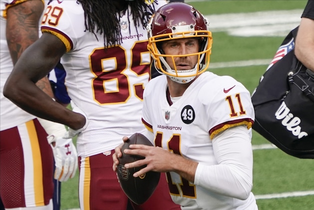 Washington Football Team quarterback Alex Smith (11) warms up before an NFL football game against the New York Giants Sunday, Oct. 18, 2020, in East Rutherford, N.J. (AP Photo/Bill Kostroun)