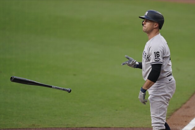 New York Yankees' Brett Gardner (11) tosses his bat after walking during the third inning in Game 5 of a baseball American League Division Series against the Tampa Bay Rays, Friday, Oct. 9, 2020, in San Diego. (AP Photo/Gregory Bull)