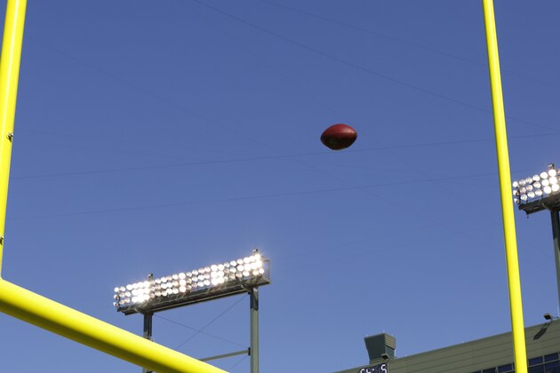 A football goes through the uprights inside Lambeau field before an NFL football game between the Green Bay Packers and New Orleans Saints Sunday, Sept. 30, 2012 in Green Bay, Wis. (AP Photo/Jeffrey Phelps)
