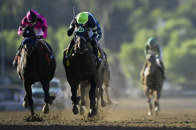 Storm the Court, right, with Flavien Prat, edges out Anneau D'or for the win in the Breeders' Cup Juvenile horse race at Santa Anita, Friday, Nov. 1, 2019, in Arcadia, Calif. (AP Photo/Mark J. Terrill)