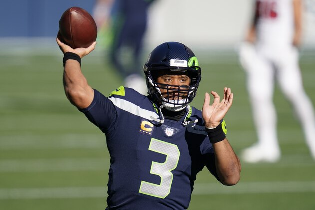 Seattle Seahawks quarterback Russell Wilson passes during warmups before the first half of an NFL football game against the San Francisco 49ers, Sunday, Nov. 1, 2020, in Seattle. (AP Photo/Elaine Thompson)