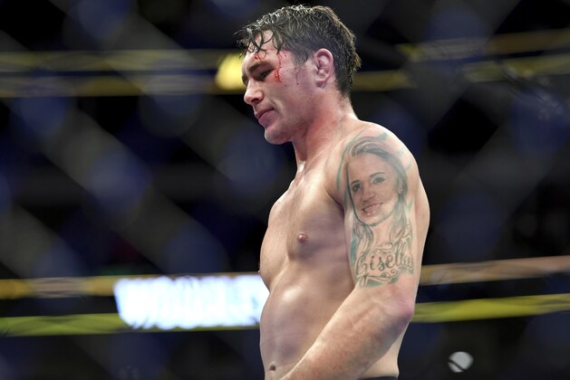Darren Till walks back to his corner after losing by submission to Tyron Woodley in their welterweight title mixed martial arts bout at UFC 228 on Saturday, Sept. 8, 2018, in Dallas. (AP Photo/Jeffrey McWhorter)