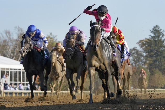 Jockey Joel Rosario celebrates aboard Vequist as they win the Breeders' Cup Juvenile Fillies horse race at Keeneland Race Course, Friday, Nov. 6, 2020, in Lexington, Ky.(AP Photo/Darron Cummings)