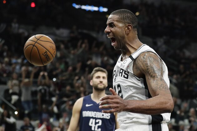 San Antonio Spurs forward LaMarcus Aldridge (12) celebrates as he scores against the Dallas Mavericks during the second half of an NBA basketball game in San Antonio, Tuesday, March 10, 2020. (AP Photo/Eric Gay)