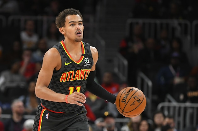Atlanta Hawks guard Trae Young (11) works during an NBA basketball game against the Charlotte Hornets, Monday, March 9, 2020, in Atlanta. (AP Photo/John Amis)