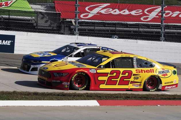Joey Logano (22) heads into turn 3 during a NASCAR Cup Series auto race at the Martinsville Speedway in Martinsville, Va., Sunday, Nov. 1, 2020. (AP Photo/Lee Luther Jr.)