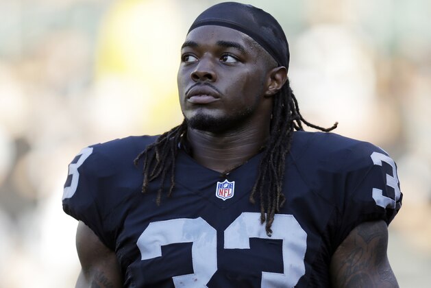 FILE - In this Aug. 14, 2015, file photo, Oakland Raiders running back Trent Richardson warms up before an NFL preseason game in Oakland, Calif. The Saskatchewan Roughriders have signed Richardson, the third overall pick of the 2012 NFL draft.  (AP Photo/Ben Margot, File)