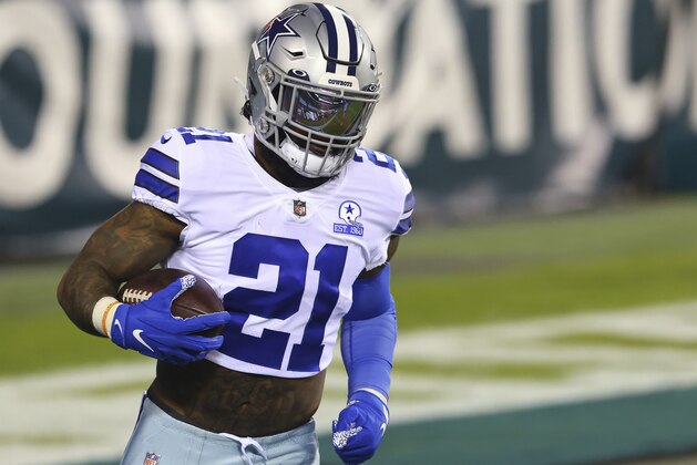 Dallas Cowboys' Ezekiel Elliott (21) warms up before an NFL football game against the Philadelphia Eagles, Sunday, Nov. 1, 2020, in Philadelphia. (AP Photo/Rich Schultz)