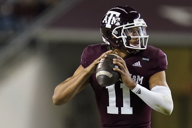 Texas A&M quarterback Kellen Mond (11) looks to pass against Arkansas during the first half of an NCAA college football game, Saturday, Oct. 31, 2020, in College Station, Texas. (AP Photo/Sam Craft)