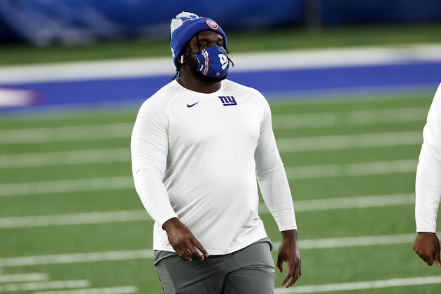 New York Giants defensive tackle Dalvin Tomlinson (94) warms up with a Foco mask before an NFL football game against the Tampa Bay Buccaneers, Monday, Nov. 2, 2020, in East Rutherford, N.J. (AP Photo/Adam Hunger)