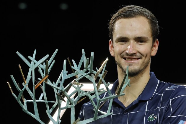Russia's Daniil Medvedev holds his trophy after the Paris Masters tennis tournament final, Sunday, Nov. 8, 2020 in Paris. Daniil Medvedev won the Paris Masters for the first time by beating Germany's Alexander Zverev 5-7, 6-4, 6-1 on Sunday for his eighth career title and third at a Masters event. (AP Photo/Christophe Ena)