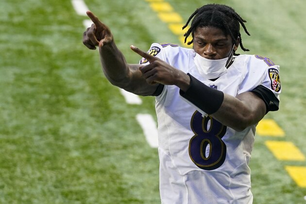 Baltimore Ravens quarterback Lamar Jackson (8) acknowledges fans as he leaves the field following an NFL football game against the Indianapolis Colts in Indianapolis, Sunday, Nov. 8, 2020. The Ravens defeated the Colts 24-10. (AP Photo/Darron Cummings)