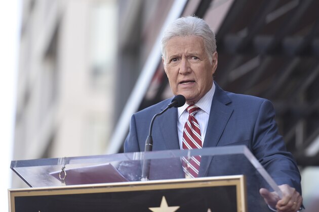 Alex Trebek speaks at a ceremony honoring Harry Friedman, executive producer of