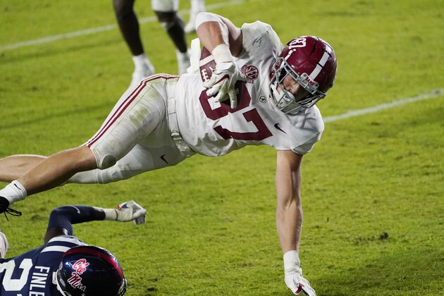 Alabama tight end Miller Forristall (87) is upended as he scores a touchdown against Mississippi during the second half of an NCAA college football game in Oxford, Miss., Saturday, Oct. 10, 2020. Alabama won 63-48. (AP Photo/Rogelio V. Solis)