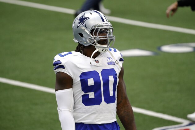 Dallas Cowboys defensive end DeMarcus Lawrence stands on the field during warmups before an NFL football game against the Pittsburgh Steelers in Arlington, Texas, Sunday, Nov. 8, 2020. (AP Photo/Roger Steinman)