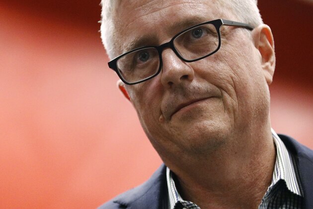 FILE - In this Oct. 24, 2019, file photo, Houston Astros general manager Jeff Luhnow departs after a news conference in Washington. Houston  manager AJ Hinch and general manager Jeff Luhnow were suspended for the entire season Monday, Jan. 13, 2020,  and the team was fined $5 million for sign-stealing by the team in 2017 and 2018 season. Commissioner Rob Manfred announced the discipline and strongly hinted that current Boston manager Alex Cora — the Astros bench coach in 2017 — will face punishment later. Manfred said Cora developed the sign-stealing system used by the Astros. (AP Photo/Patrick Semansky, File)