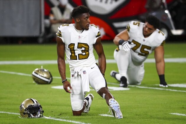 New Orleans Saints wide receiver Michael Thomas (13) looks on while stretching prior to an NFL football game against the Tampa Bay Buccaneers, Sunday, Nov. 8, 2020, in Tampa, Fla. (AP Photo/Kevin Sabitus)