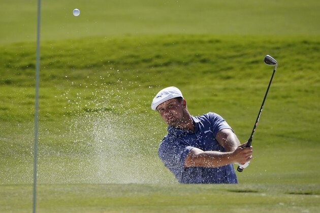 Bryson DeChambeau hits out of a bunker onto the ninth green during the final round of Shriners Hospitals for Children Open golf tournament Sunday, Oct. 11, 2020, in Las Vegas. (AP Photo/John Locher)